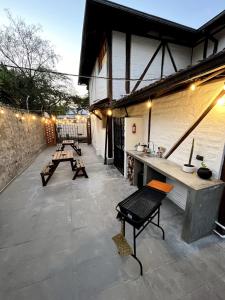 a patio with benches and a counter on a building at Modern Apartment with Private Balcony in Quito +11 photos