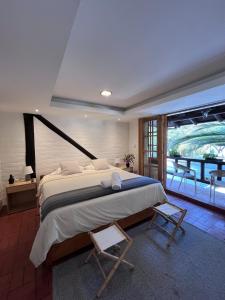 a bedroom with a large bed and a balcony at Modern Apartment with Private Balcony in Quito