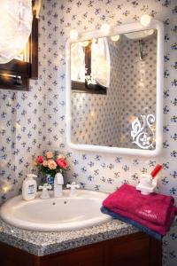 a bathroom with a sink and a mirror at Casa Vacanze Paola 2 in Santa Luria +23 photos