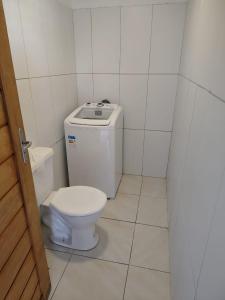a small bathroom with a toilet in a stall at Sol de Caraúbas in Caraúbas