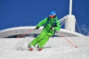 a man is skiing down a snow covered slope at Casa Montilla in Granada