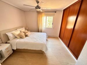 a bedroom with a bed and a ceiling fan at Casa Mar in Valencia +21 photos