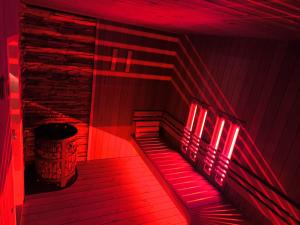 a red room with red lights on the stairs at Liptovský mlyn in Bešeňová