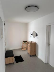 a room with a table and a mirror on the wall at Ferienhaus Arlewatt in Arlewatt +9 photos