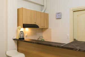 a kitchen with a counter top and a sink at Central Cozy Apartment 4 in Sparta