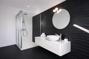 a bathroom with a sink and a mirror at Casa Rural La Esencia in Araguás
