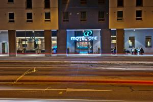 a more one sign on the side of a building at Motel One München-East Side in Munich