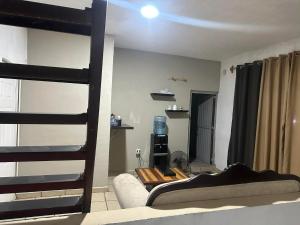 a living room with a bunk bed and a couch at Cuarto a 4min del aeropuerto in Guadalajara
