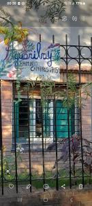 a building with a fence in front of it at Aguaribay in Córdoba