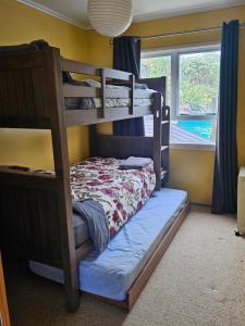 a bedroom with two bunk beds in a room at The Castle in Baylys Beach