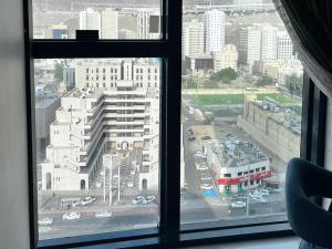 a view of a city from an office window at Montana Golden Hotel in Mecca