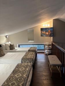 a hotel room with two beds and a swimming pool at Cretan stars villas Hersonissos in Hersonissos +129 photos