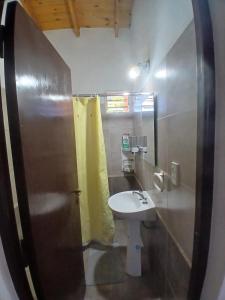 a bathroom with a sink and a toilet at Apart La Jose in Río Cuarto