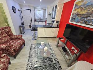a living room with a couch and a table at A Pearl Place in Pretoria