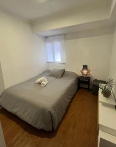 a bedroom with a bed with a towel on it at El Rincón Azul in Jalance
