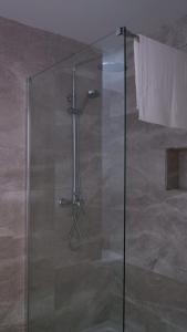 a shower with a glass door in a bathroom at Peprina Apt 2 in Central Rabat in Rabat