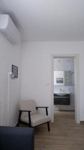 a living room with a chair and a table at Peprina Penthouse in Central Rabat in Rabat
