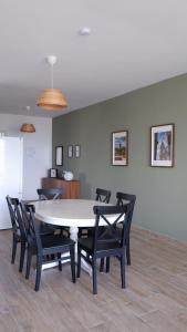 a dining room with a white table and chairs at Peprina Penthouse in Central Rabat in Rabat