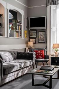 a living room with a couch and a table at The Melita in London
