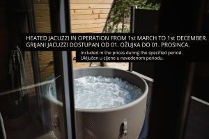 a bucket of water sitting in a window at Pinery Blidinje A-Frame House in Blidinje