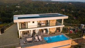 an aerial view of a house with a swimming pool at Villa 360 in Calaca