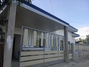 a building with a fence in front of it at Next House Passi City in Iprog