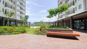 a bench in the middle of a courtyard in a building at Osaka Riverview PIK2 By Micky Studio 4 in Rawalumpang