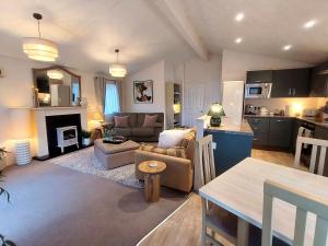 a living room with a couch and a table at 10 lochview in Moffat