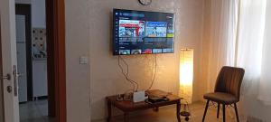 a living room with a tv on the wall at Alyakek Apartment in Istanbul