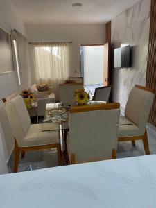 a living room with a table with a laptop on it at ajmicasita in Constanza