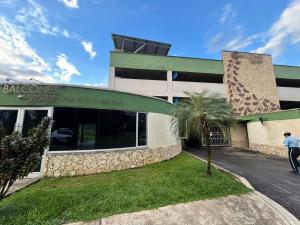 a man walking in front of a building at Balcones del Bosque 14 -402 in Restrepo