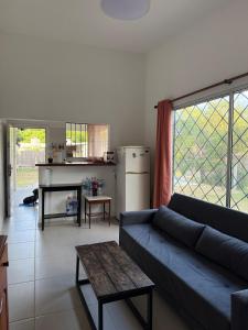 a living room with a couch and a table at House in La Tuna in Balneario Argentino
