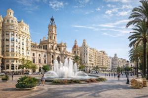 a fountain in front of a large building at Bigbass Valencia Centro in Valencia
