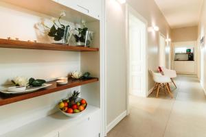 a kitchen with a bowl of fruit on a shelf at Prima Luxury Rooms in Split