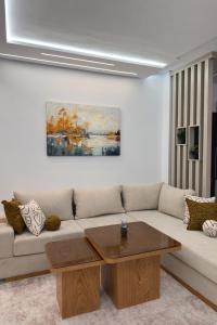a living room with a couch and a coffee table at Sirena Apartment Tangier in Tangier
