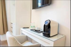 a coffee machine sitting on a counter in a room at Urban Stay Siena in Siena
