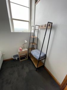 a room with two bunk beds and a window at Modern refine home in Bellerive