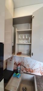 a kitchen with a sink and a counter top at Kęstučio 66 apartamentai in Kaunas +19 photos