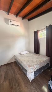 a bedroom with a bed in a room at La casita de Ivanna in San Bernardino +3 photos