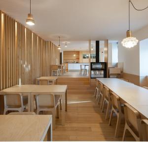 a dining room with wooden tables and chairs at Colmeal Countryside Hotel in Figueira de Castelo Rodrigo