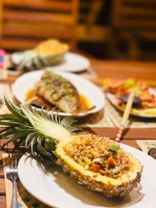 a table with plates of food on a table at Yala Wild trails - Stay inside the Yala national Park with safari game drive in Kirinda