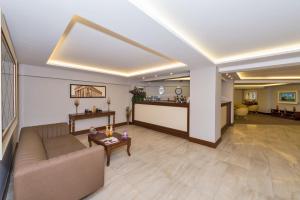 a living room with a couch and a table at Bergama Hotel in Istanbul