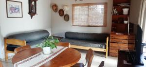 a living room with a table and a couch at Las Guardia in Cortaderas