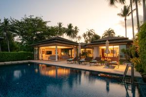 a house with a swimming pool in front of a house at Baan Leelawadee in Bophut