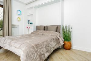 Un pat sau paturi într-o cameră la Click&Sleep Fuorigrotta