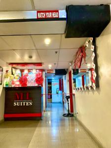 a mall entrance with a mil switches sign on the wall at ML SUITES CEBU in Cebu City