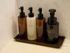 a group of four bottles on a shelf at Nikko Station Hotel Classic in Nikko