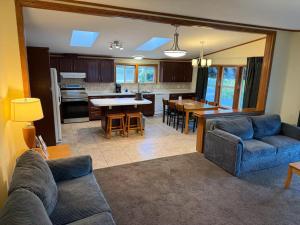 a living room with a couch and a dining room at Black Hawk Motel & Suites in Wisconsin Dells