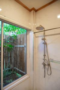 a shower in a bathroom with a window at Nuearnaam Lychee House Chiang Mai in Ban Pa Miang +64 photos
