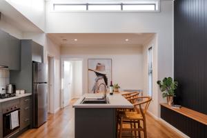 a kitchen with a sink and a counter top at Sixty - House 2 in Currie